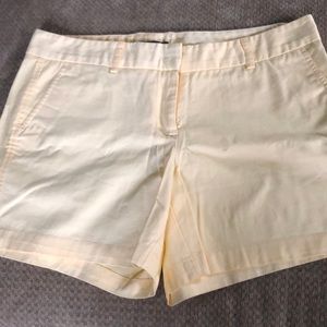Pale yellow shorts, size 6